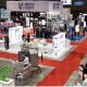 Customers having a look at the products showcased at various stall during a trade show.