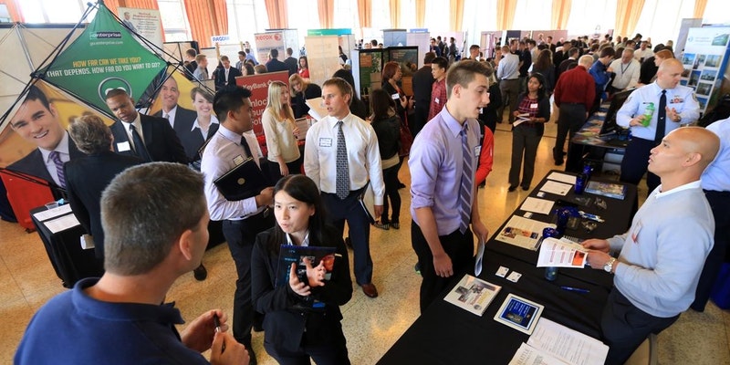 People walk around the boothes at Job Fair, the biggest job fair event.